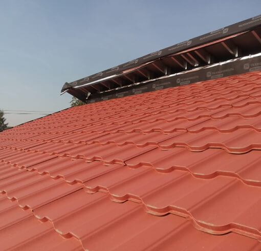 Металлочерепица Геркулес Элит модульный покрытие RoofTop Бархат цвет Терракотовый фото крыши